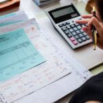 asian-woman-working-through-paperwork