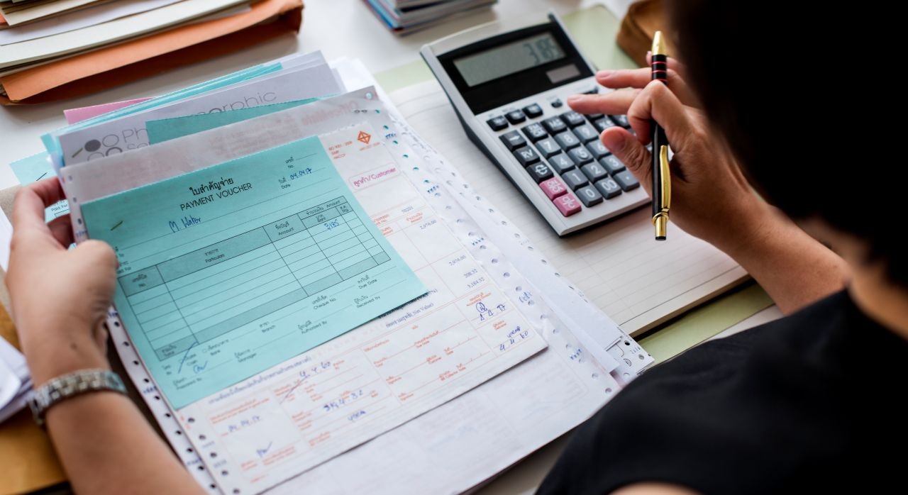 asian-woman-working-through-paperwork